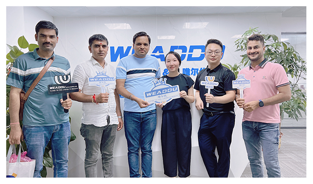 team hosting customer's fashion brand buyers for a factory tour and product review