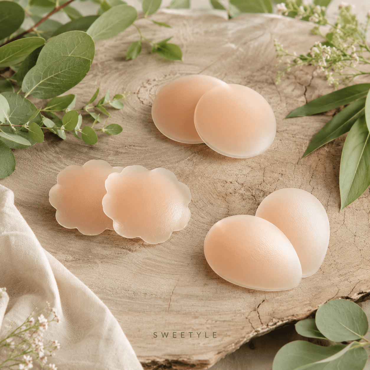 Eco-friendly medical-grade silicone nipple covers on a natural background..png